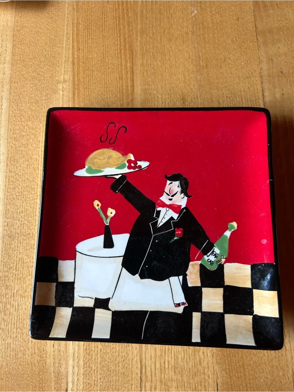 Fun Whimsical Server Illustration on a Ceramic Red and Black Plate